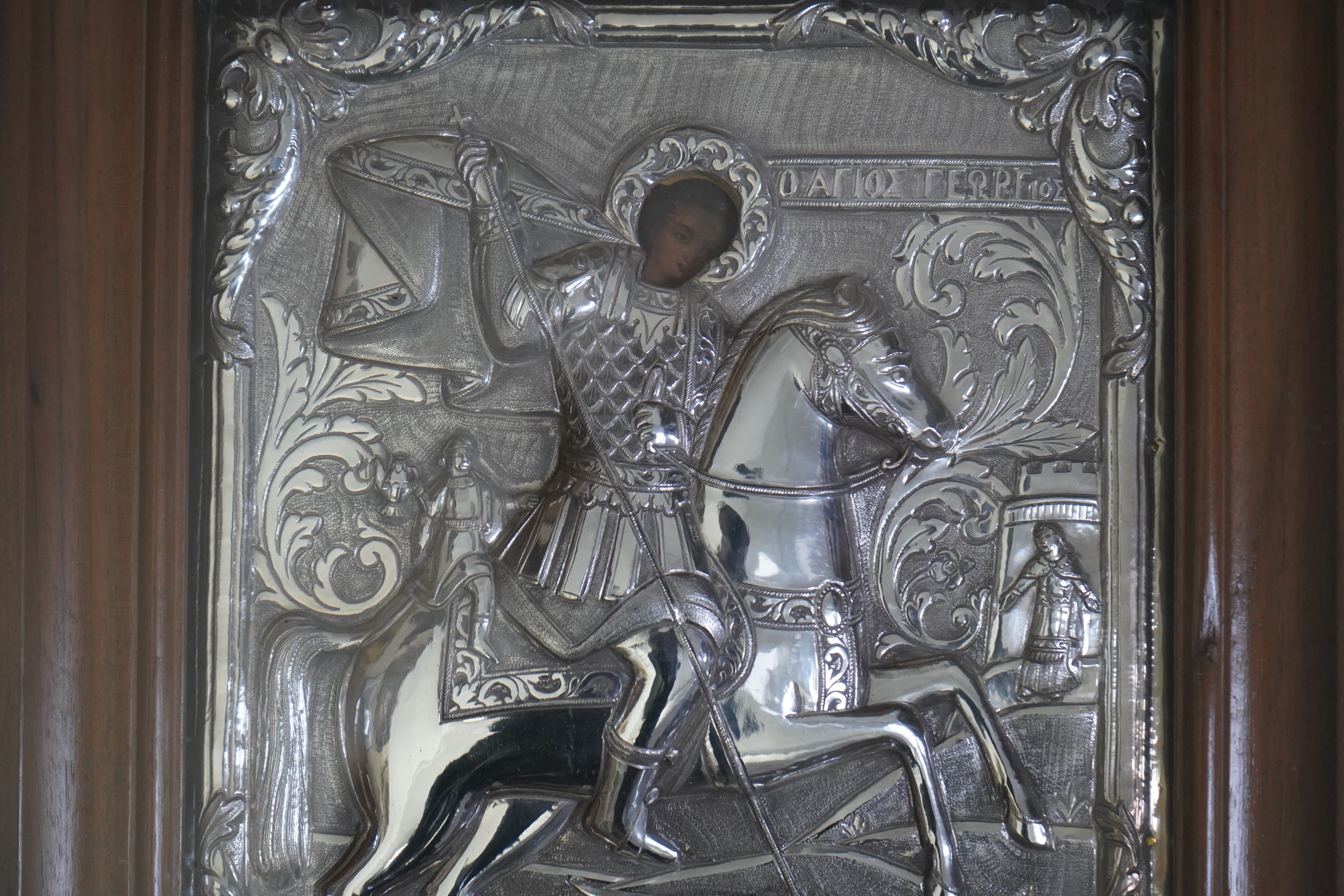 19th century Greek School , St George and the dragon, icon with silver oklad, 28 x 24cm